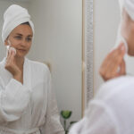 in-a-bathrobe-young-woman-applying-skincare-pro-2023-11-27-05-13-42-utc