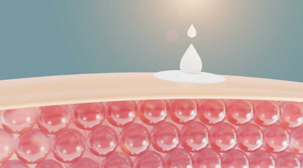 Gota de crema de vitamina en la celula de la piel